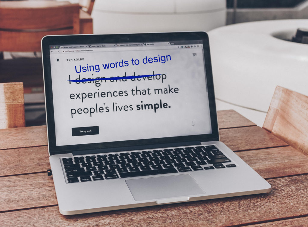 A laptop that displays the text "Using words to design experiences that make people's lives simple"